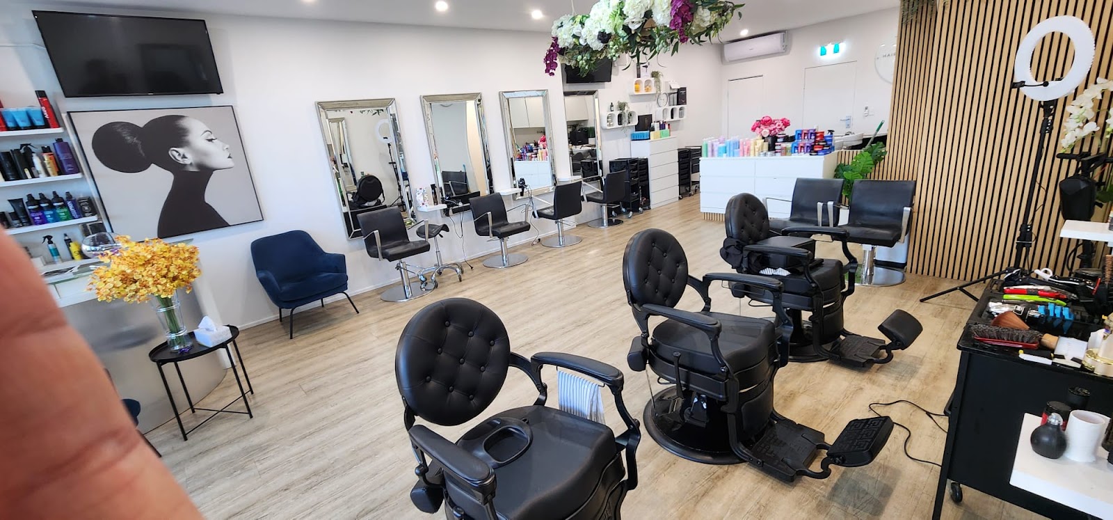 Inside Z-fade — classic black barber chairs, salon mirrors and styling stations