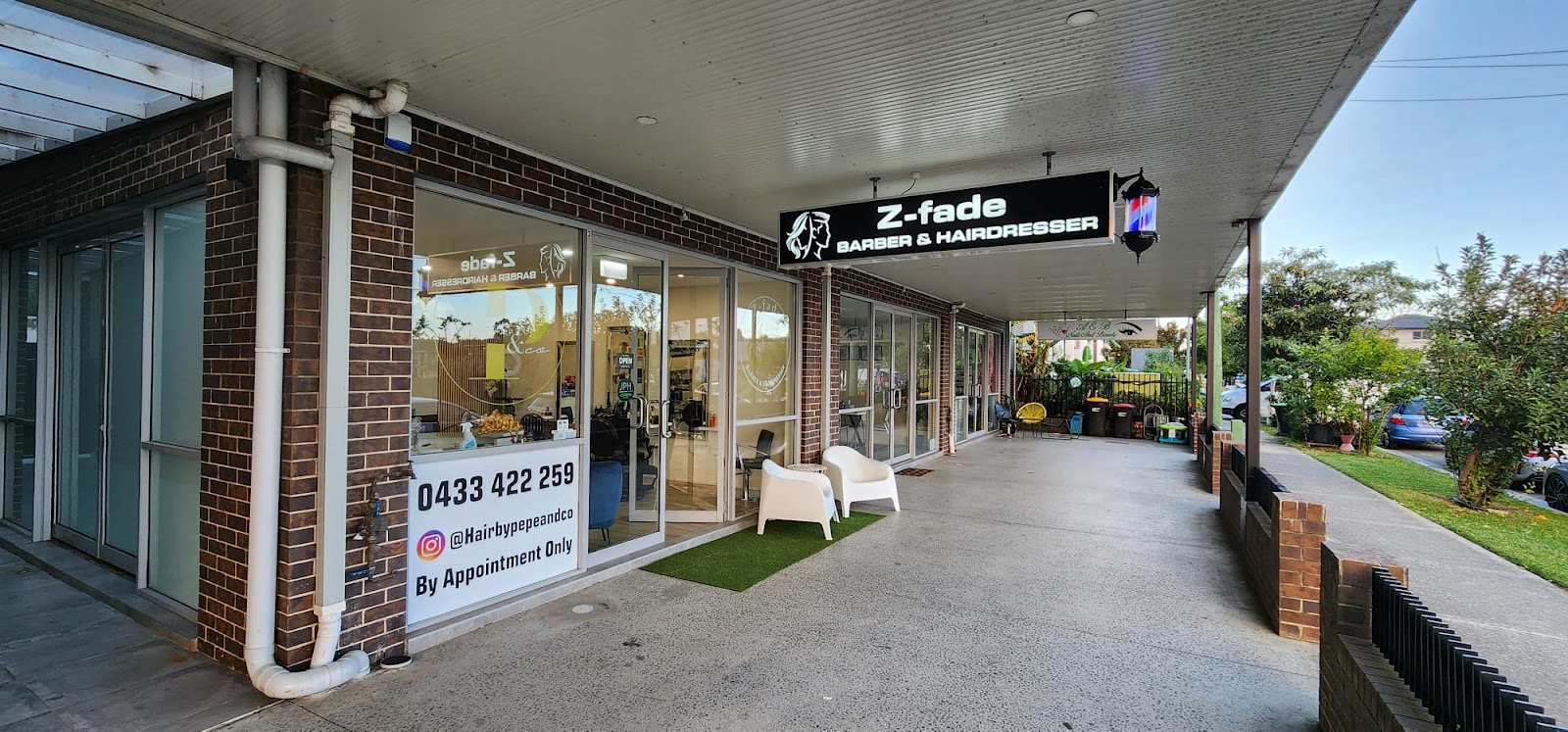 Z-fade entrance and outdoor seating under the shopping strip awning in Casula